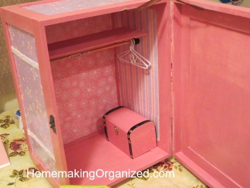 Inside the doll closet without any clothes. Also includes the cute little trunk where she kept doll shoes. 