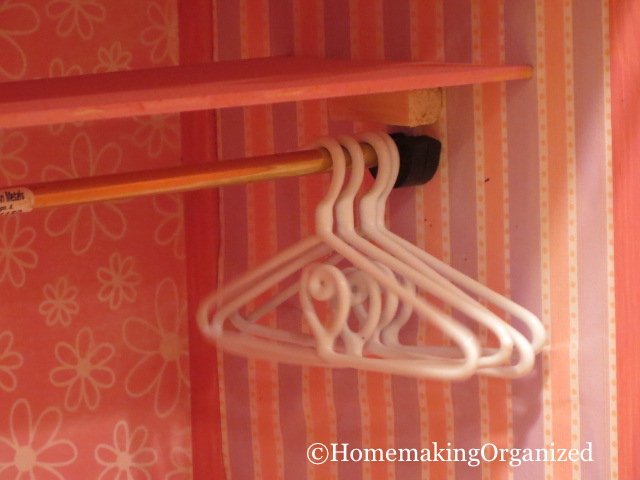 Little hangers for the clothes in the closet. You can see up close how we attached the shelf and rod.